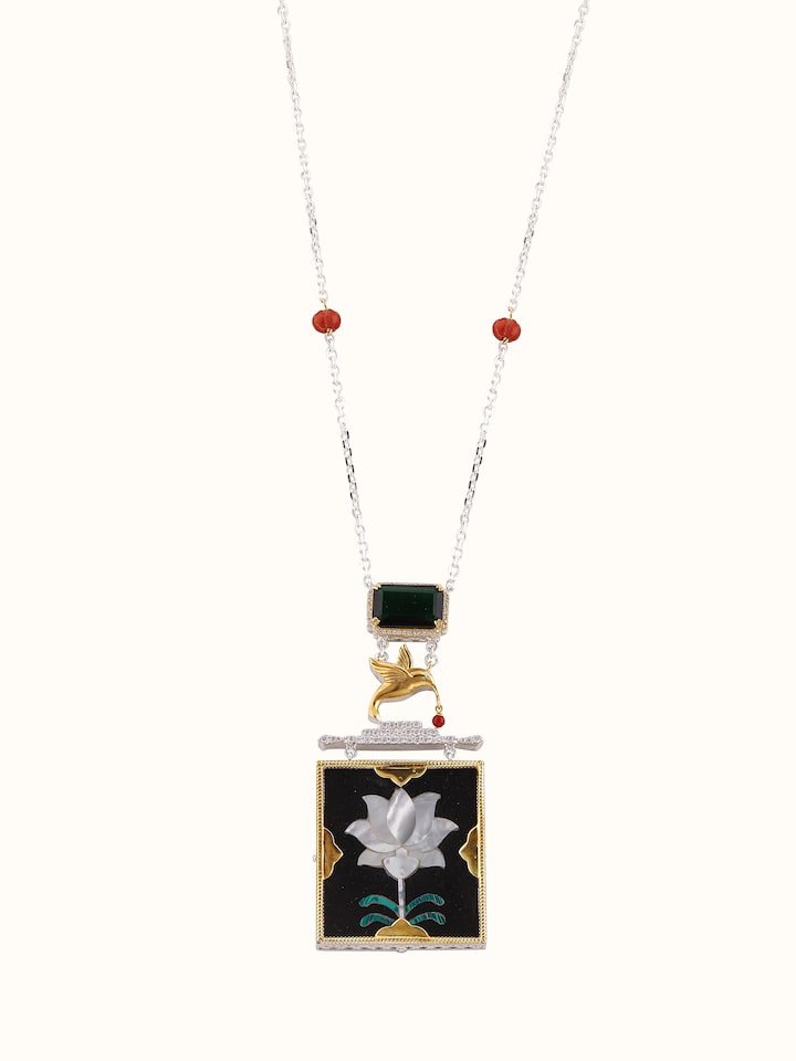 Front view of Parchinkari silver pendant and chain showcasing detailed traditional craftsmanship