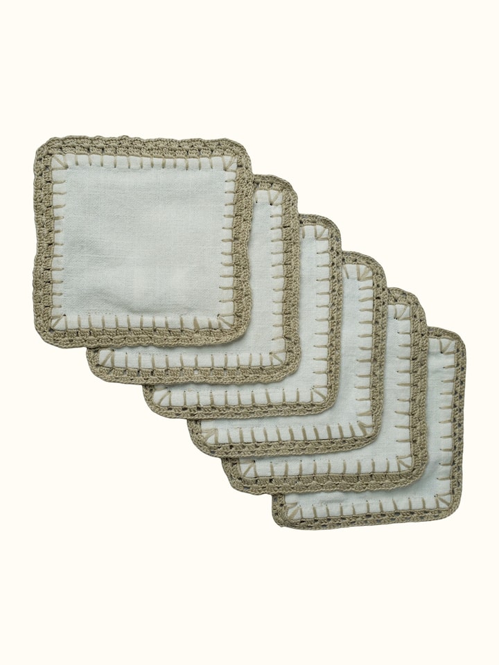 Front view of Nityam Ivory Cotton Slub Crochet Coasters Set Of 6 showing the full piece and pattern