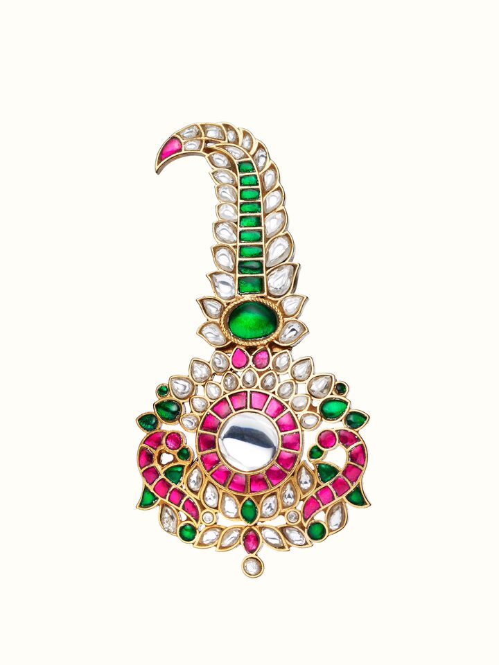 front view of silver smithing yellow gold brooch pin with intricate design