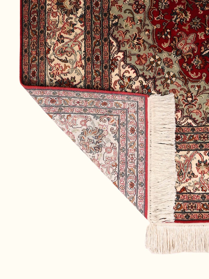 Side-angle view of the Traditional Persian Red Ivory Kashan Kashmir Silk Hand-Knotted Carpet