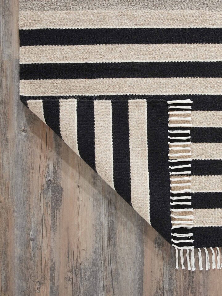 Flat lay of Nomad Stripes Black Beige Jawaja Wool & Cotton Handloom Dhurrie (3x5 ft) showcasing the full design and pattern