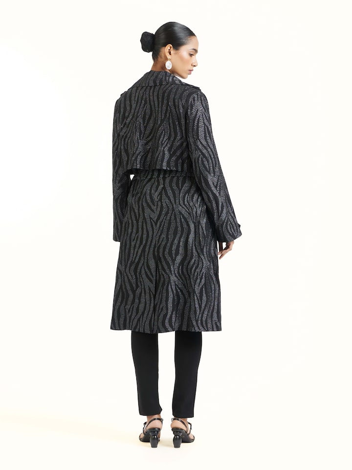 Back view of black aari hand embroidered trenchcoat displaying full length and design