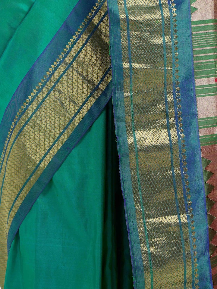 Detail view of green silk Paithani saree showing fine zari craftsmanship